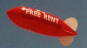 advertising blimp with FREE RENT lettering