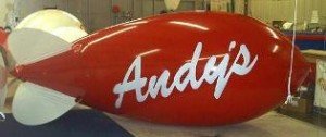 red color advertising blimp with Andys logo