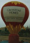 cold-air advertising balloon - Greystone Homes banner