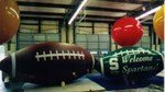 Footballs - We can reproduce your artwork on the balls. Giant helium football balloons and football cold-air inflatables available for sale or rent. 10ft. footballs from $1176.00