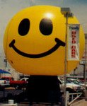 Smiley Face Balloon - giant 25ft. tall Happy Face cold-air inflatables for purchase and rent.