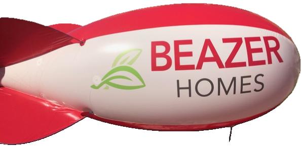 A red Beazer Homes advertising balloon with custom logo, an example of aerial advertising for home builders in Phoenix.