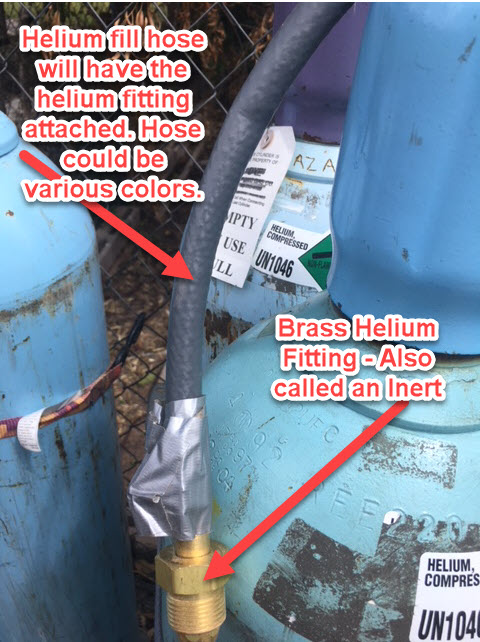 Helium fill hose connected to a cylinder with a brass inert fitting